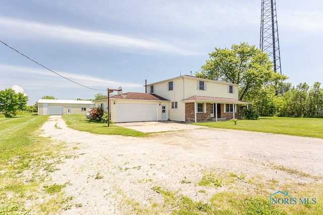 view of front of home with a garage and a front yard