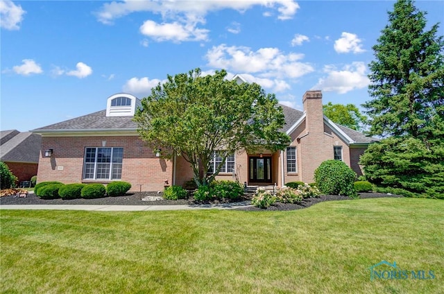 view of front of home with a front yard