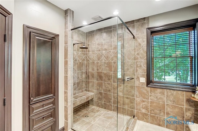 bathroom with a tile shower