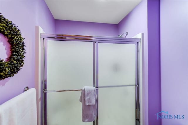 bathroom featuring walk in shower