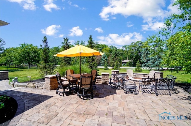 view of patio / terrace with an outdoor fire pit