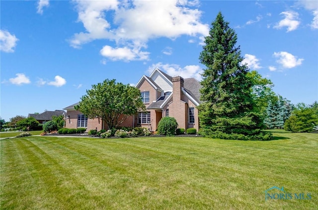 view of front of property with a front lawn