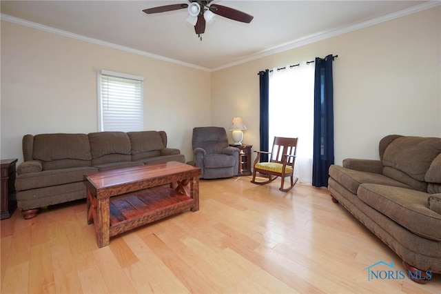 living room with ceiling fan, light hardwood / wood-style flooring, and crown molding