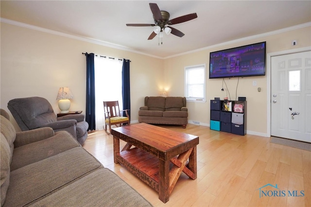 living room with ceiling fan, crown molding, and wood-type flooring