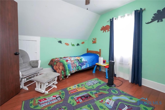 bedroom with lofted ceiling, wood-type flooring, and ceiling fan