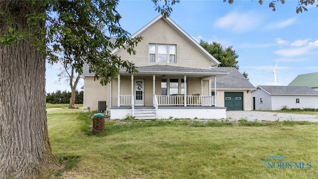 view of front of house with a porch and a front yard