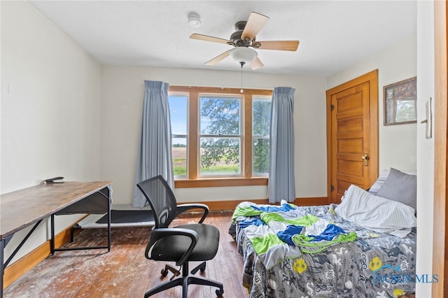 bedroom featuring ceiling fan and wood-type flooring