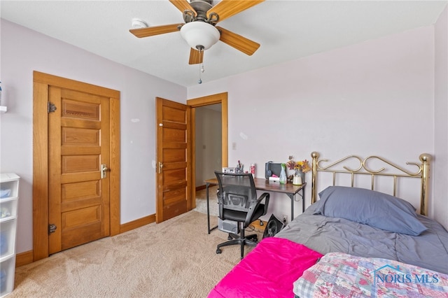 bedroom featuring ceiling fan and light carpet