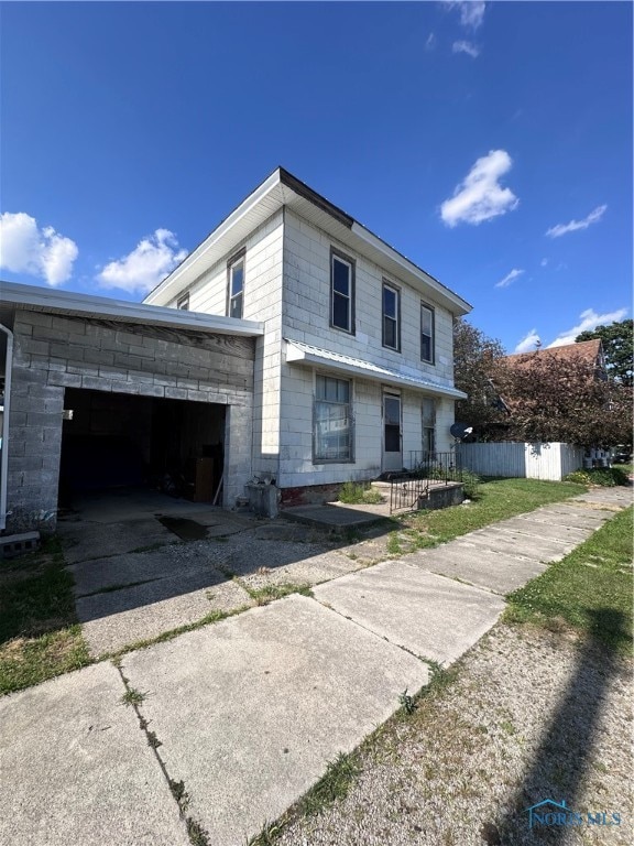 view of front of property with a garage