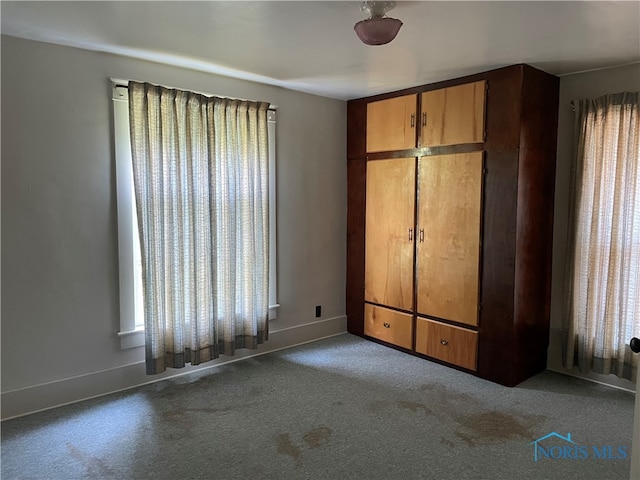 unfurnished bedroom with carpet floors