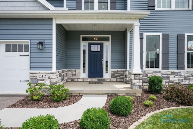 doorway to property with a porch