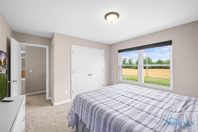 carpeted bedroom featuring a closet