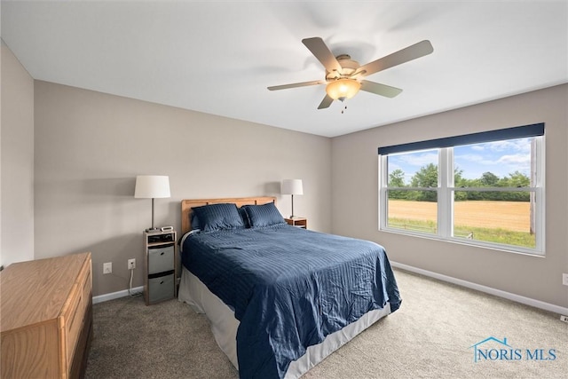 bedroom featuring ceiling fan and carpet floors