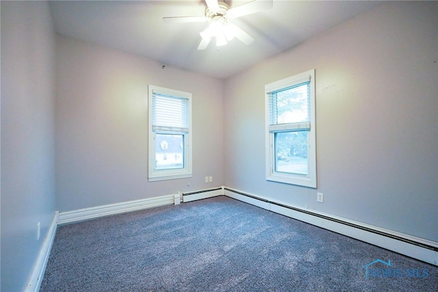 carpeted empty room with a baseboard radiator and ceiling fan