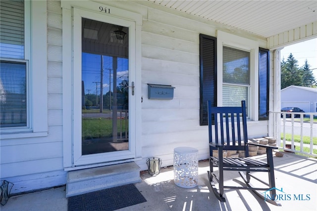 entrance to property featuring a porch