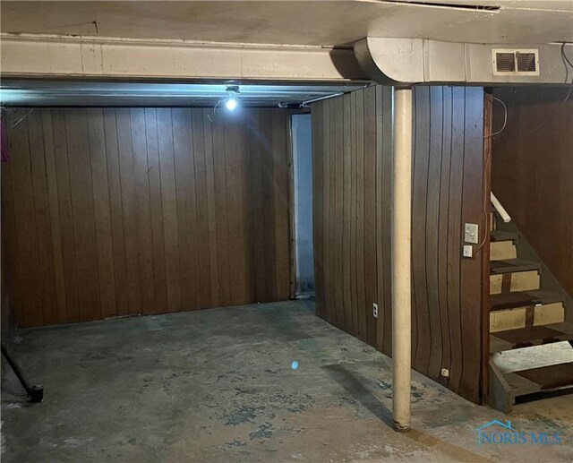 basement with wood walls