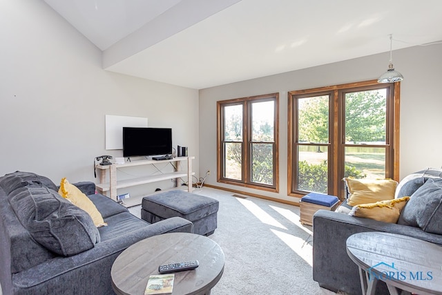 living room featuring carpet floors and lofted ceiling