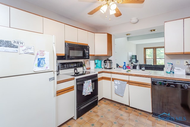 kitchen featuring sink, black appliances, white cabinets, ceiling fan, and light tile patterned flooring