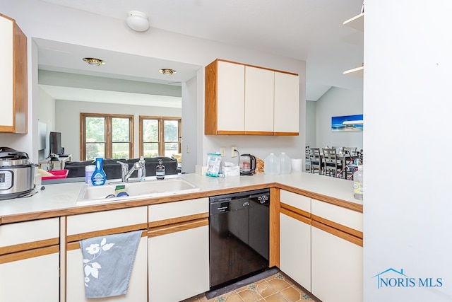 kitchen with sink, white cabinetry, dishwasher, light tile patterned floors, and kitchen peninsula