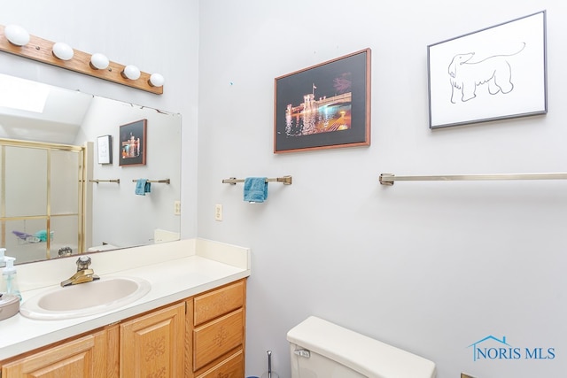 bathroom with toilet and vanity