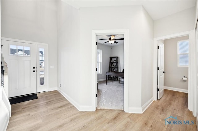 entrance foyer featuring light wood-style floors and baseboards