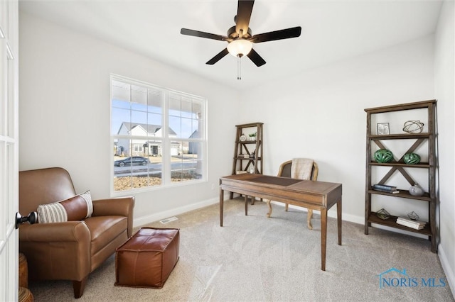 home office with carpet, baseboards, and ceiling fan