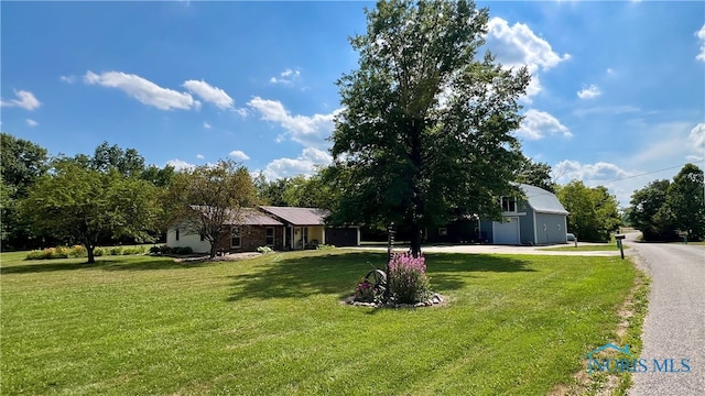 view of yard with a garage