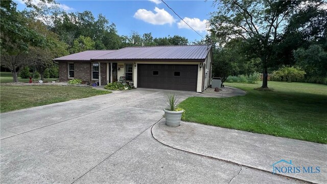 ranch-style house with a front lawn and a garage