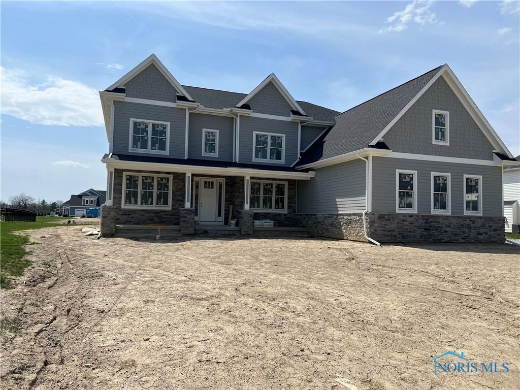 3688 Turtle Creek Dr, Perrysburg, OH 43551 - craftsman house featuring stone siding and covered porch