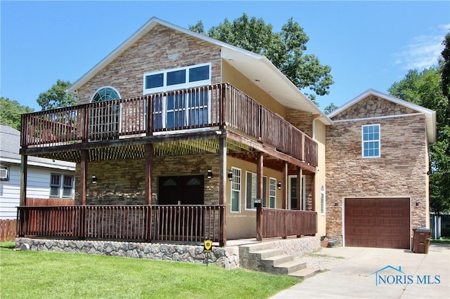 view of front facade featuring a garage and a front lawn