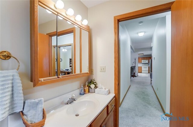 bathroom with vanity and ceiling fan