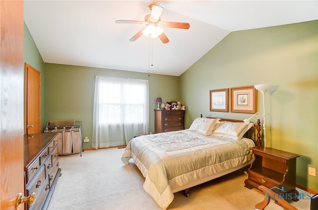 bedroom with ceiling fan, lofted ceiling, and light colored carpet