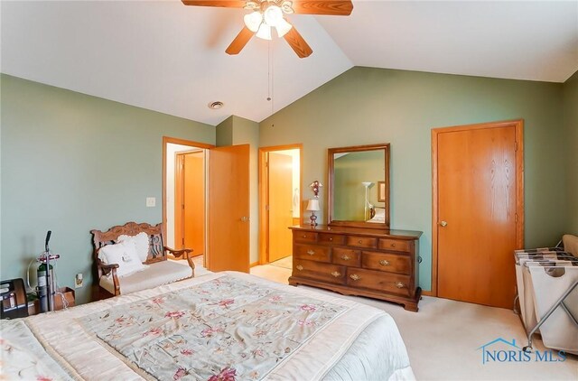 bedroom featuring carpet floors, ceiling fan, and lofted ceiling