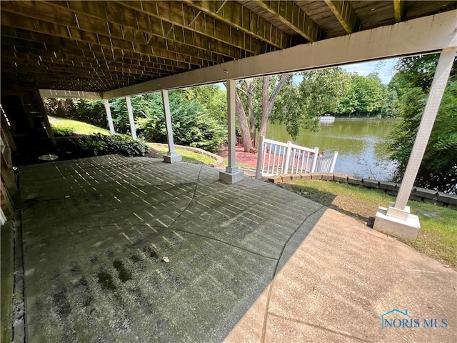 view of patio with a water view