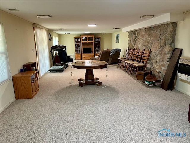 living room featuring carpet and heating unit