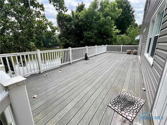 wooden terrace with a water view