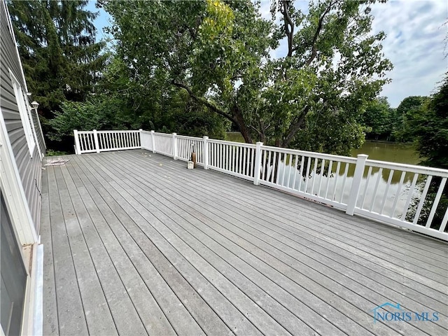 wooden deck with a water view