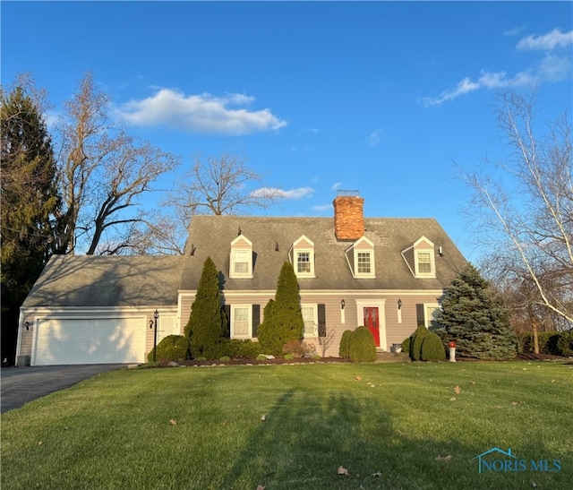 view of front of house featuring a garage and a front yard