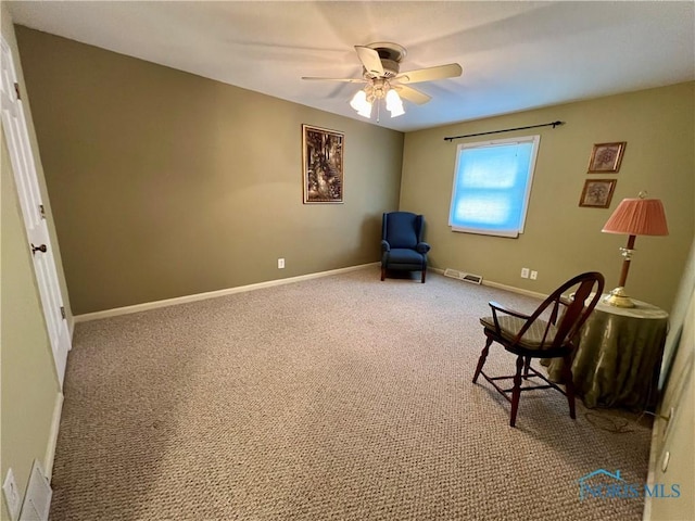 unfurnished room with ceiling fan and carpet