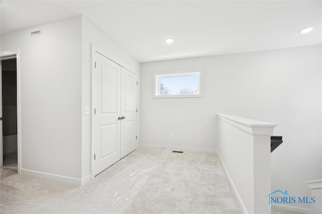 interior space featuring light colored carpet