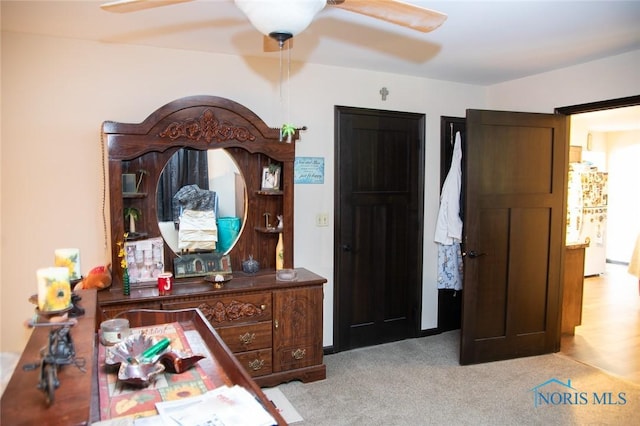 carpeted bedroom featuring ceiling fan