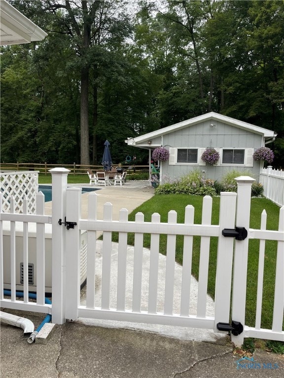 exterior space with a front lawn and a patio