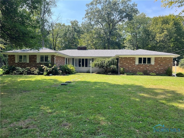 ranch-style house with a front lawn