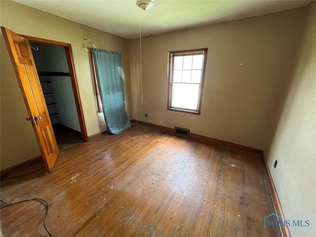 unfurnished bedroom with wood-type flooring