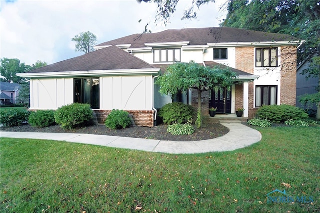 view of front of home with a front lawn