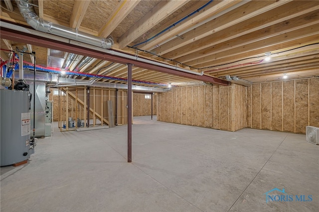 basement featuring water heater and heating unit