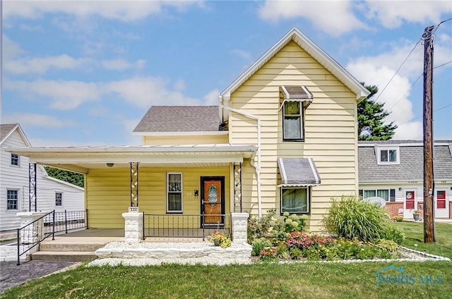 534 Clinton Ct, Findlay, OH 45840 - view of front of property with a front yard and a porch
