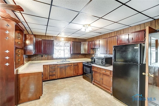 kitchen with sink and black appliances