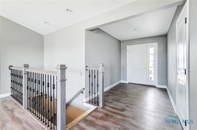 entryway with hardwood / wood-style flooring