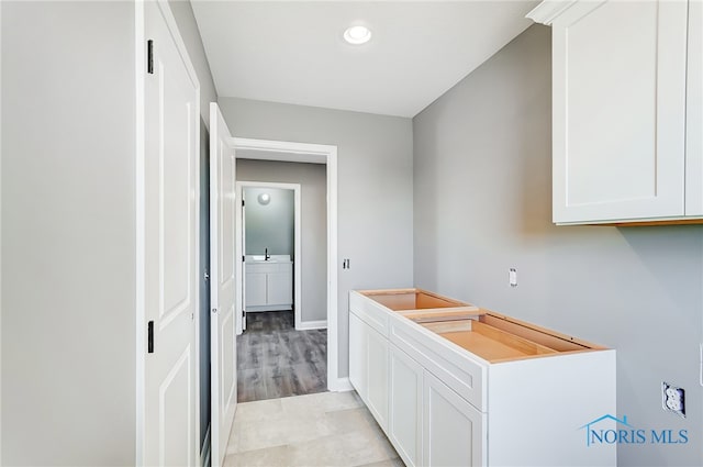 interior space featuring light wood-type flooring and sink